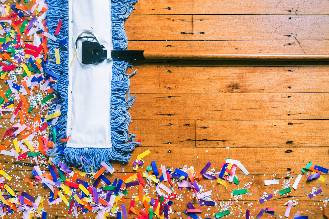 Confetti on floor being cleaned up