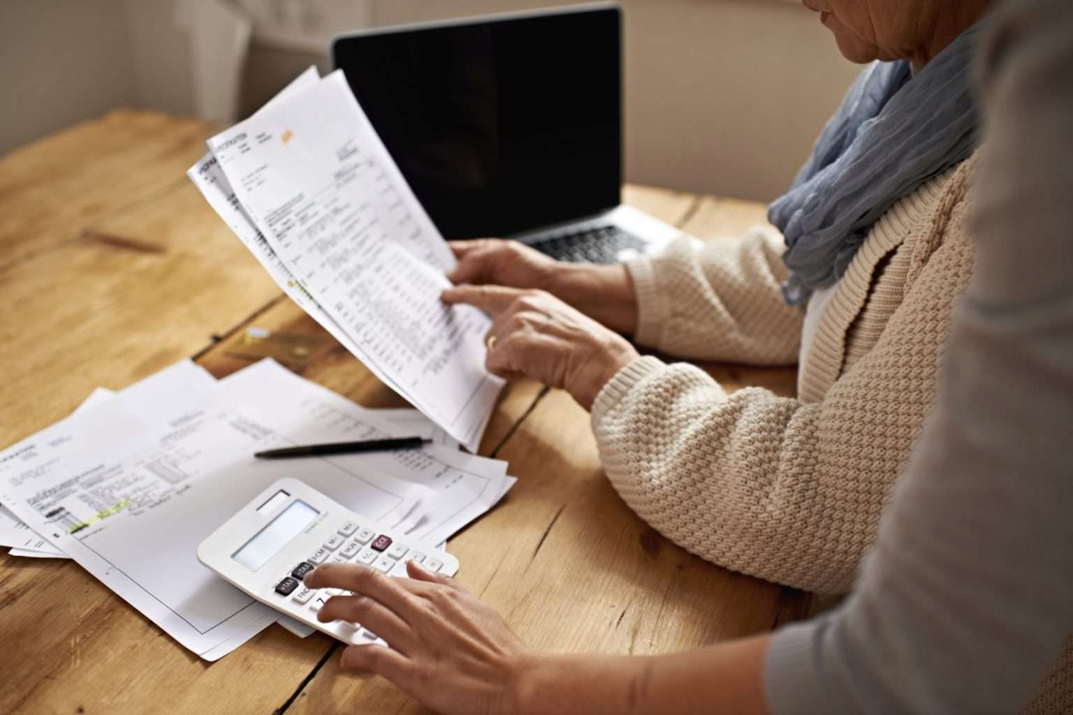 Two people reviewing paperwork at a table