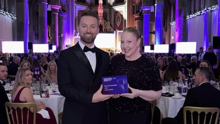 Debt Free Advice team holding award for Best Use of Tech